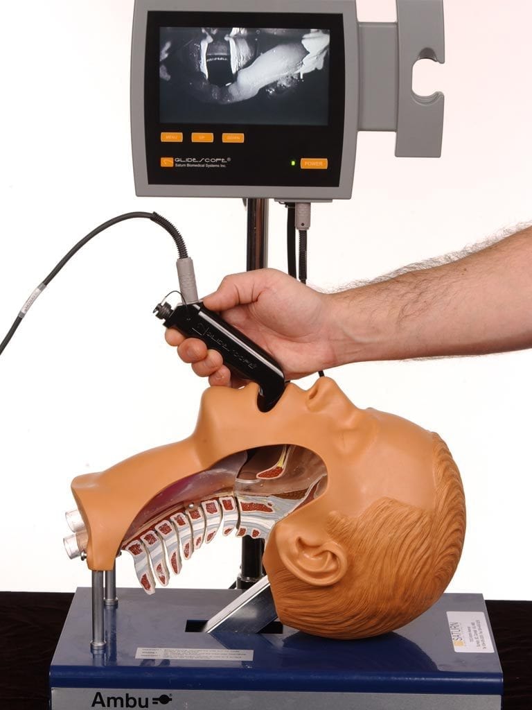 Laryngoscope intibation device being tested on dummy.