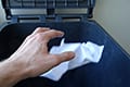 Thumbnail image of a hand throwing paper into recycling bin.