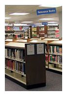 Image of the library with shelves holding books.