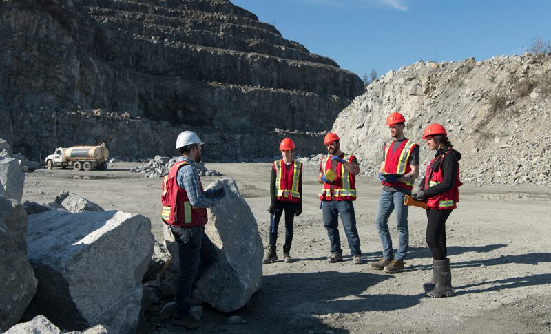 Mining students visiting a site.