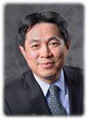 Photo of James Cai over a grey background