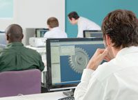 computer lab with students and a teacher