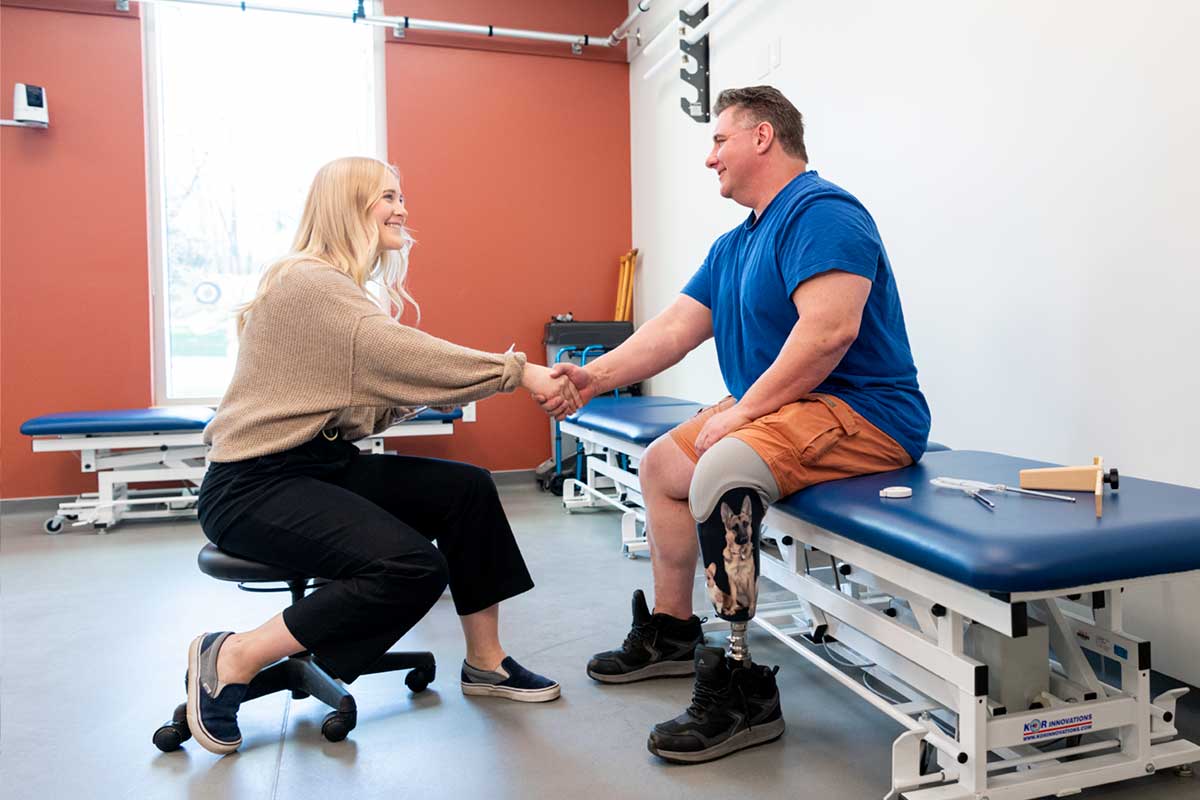 BCIT prosthetics and orthotics student shaking hands with a patient