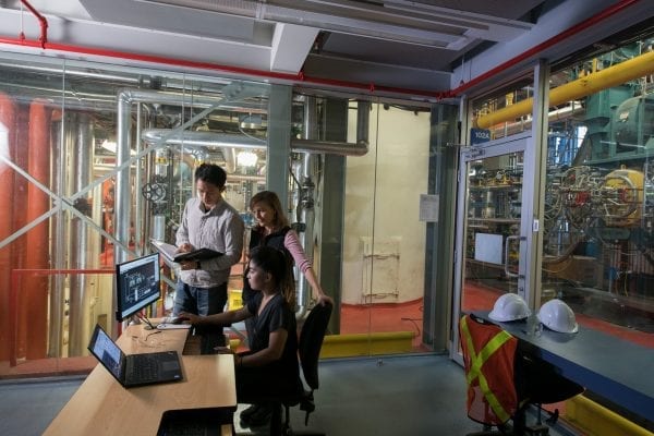 An instructor and students inside the BCIT Spartan Controls Centre for Energy Education and Research