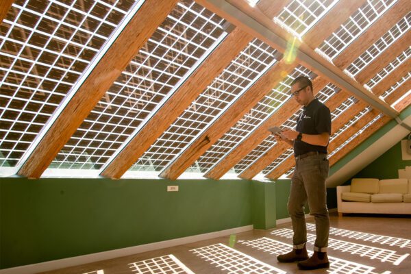 Image of Colin Chan under the solar panel roof in AFRESH Home.