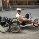 Jaimie Borisoff in a tandem recumbent bike on the road