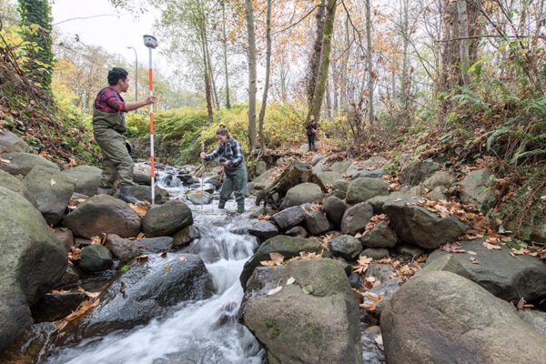 BCIT Ecological Restoration students assess conditions of Guichon Creek at the Burnaby Campus.