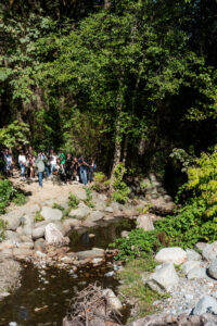 Mark Angelo leading a group on an interpretive tour of Guichon Creek on the BCIT Burnaby campus for the inaugural Guichon Creek Day in 2022. 