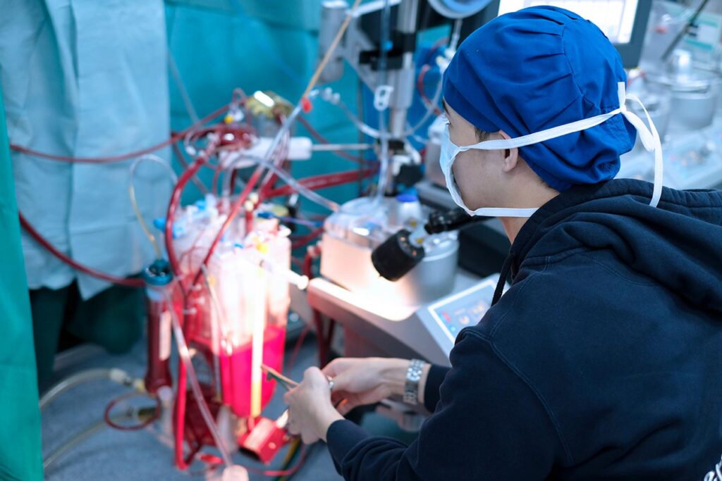 male perfusionist sitting in cardiac operating room