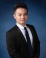 photo of steven zeng square face with short black hair in black blazer and dark purple tie