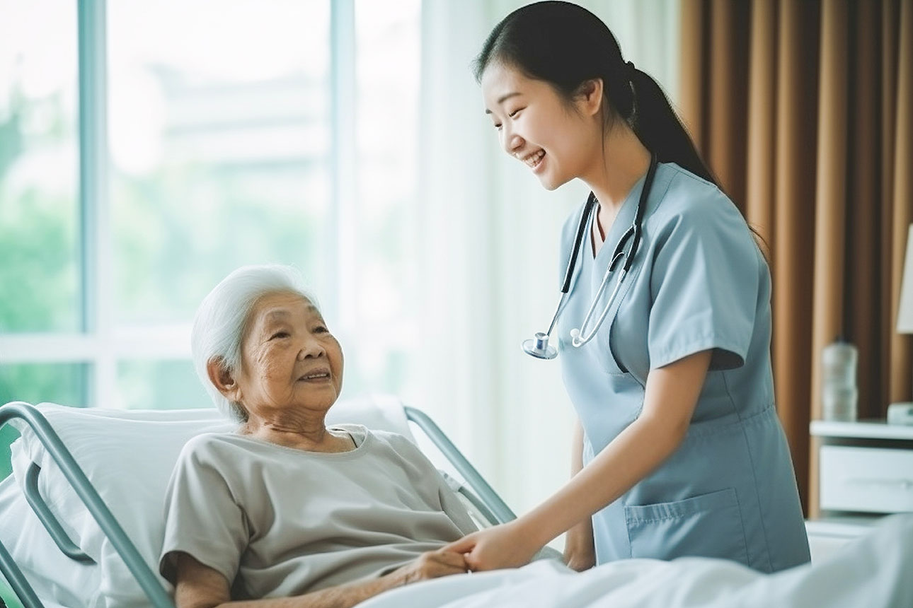 Smiling Asian caring nurse supporting holding hand of olde senior female patient lying on bed at clinic or hospital.